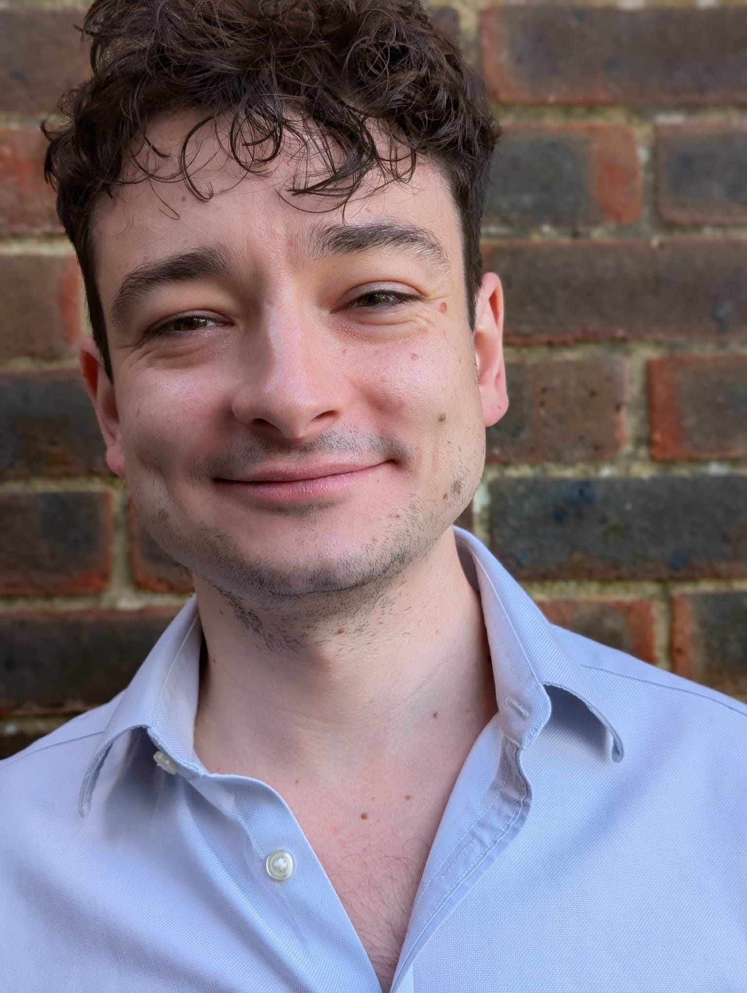 A photo of Kurt Wood, a technical SEO consultant, looking a bit smug.